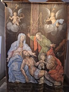 Religiöse Szene mit Engeln und Trauernden, die Jesus nach der Kreuzigung umgeben.